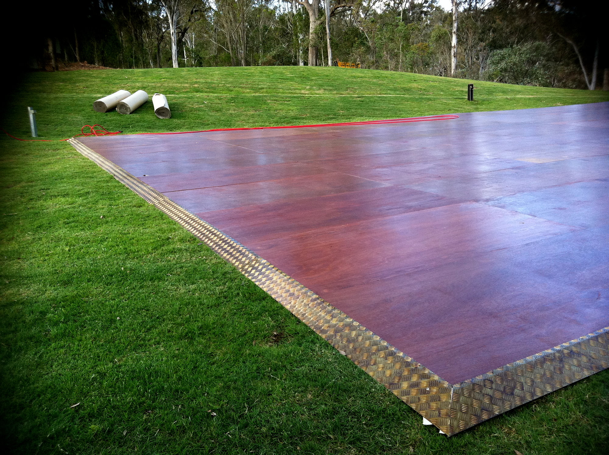 Ply flooring with finishing overlay